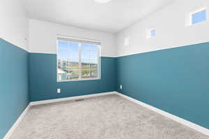 Unfurnished room with carpet floors