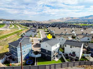 Aerial perspective of suburban area with a mountain backdrop