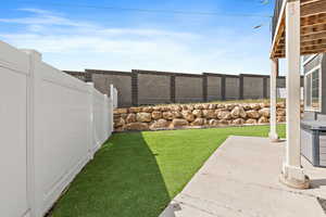 Fenced backyard featuring a patio area