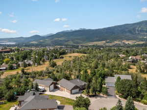 Aerial perspective of suburban area featuring a mountainous background