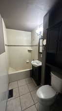 Full bath featuring tile patterned flooring and vanity