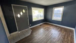 Entrance foyer with wood finished floors and baseboards