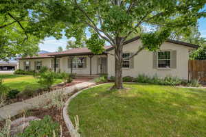 Ranch-style home featuring brick siding