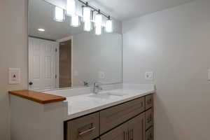 Bathroom featuring vanity and recessed lighting
