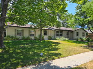 Single story home with brick siding