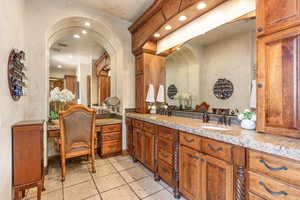 Bathroom featuring recessed lighting and vanity