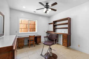 Office area with built in study area, light tile patterned floors, a ceiling fan, and recessed lighting
