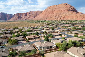 Aerial perspective of suburban area featuring a mountain backdrop
