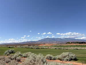 View of mountain backdrop featuring rural landscape
