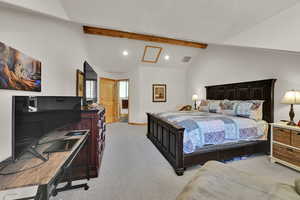 Bedroom with light carpet, recessed lighting, an office area, and a textured ceiling