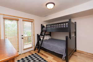 Main floor bedroom with bunk bed. Currently room is used as an office.