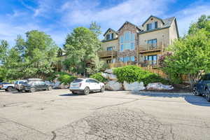 View of car parking featuring french doors
