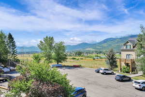 View of mountain backdrop featuring rural landscape