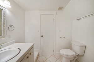 Bathroom with vanity and tile patterned flooring