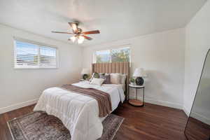 Bedroom featuring wood finished floors and a ceiling fan