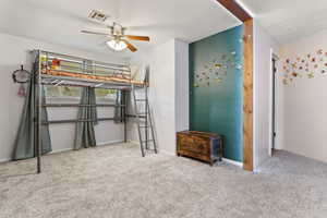 Unfurnished bedroom with carpet floors and ceiling fan
