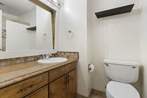 Bathroom featuring toilet and vanity