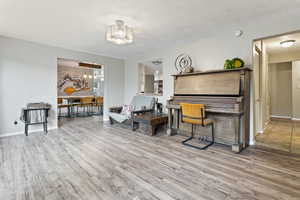 Living area featuring wood finished floors and baseboards
