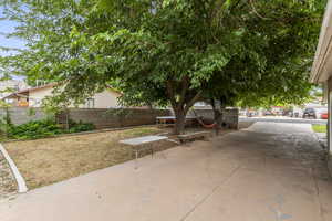 Fenced backyard with a patio