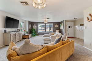 Living room with carpet floors and baseboards