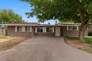 Ranch-style house with stucco siding