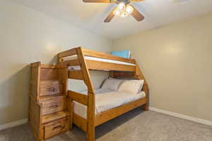 Bedroom with carpet flooring and ceiling fan