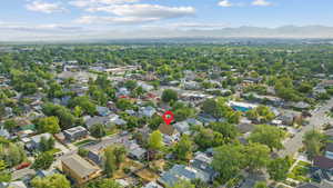 Aerial overview of property's location featuring a mountainous background