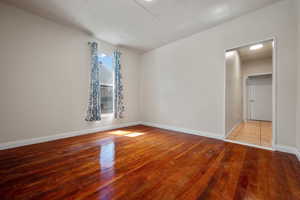 Spare room featuring hardwood / wood-style flooring