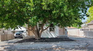 View of property hidden behind natural elements