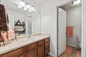 Bathroom with vanity and tile patterned flooring