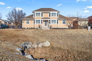View of front of property featuring a shingled roof