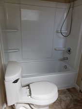 Bathroom featuring  shower combination and toilet