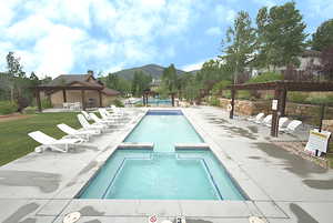 View of swimming pool featuring a pergola, a gazebo, a mountain view, and apatio area