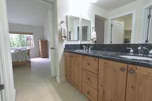 Full bath featuring double vanity