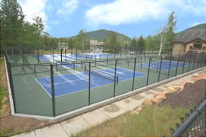 View of pickle ball courts featuring a mountain view and community basketball court