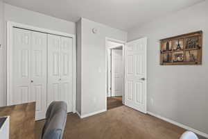 Carpeted home office with baseboards