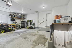 Garage featuring a garage door opener