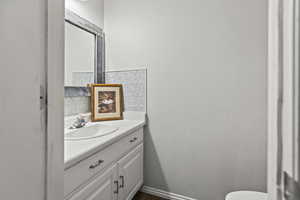 Bathroom featuring vanity and toilet