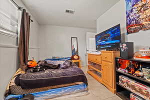 Bedroom featuring light tile patterned floors