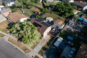 Aerial view of property's location with nearby suburban area