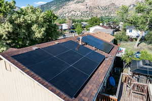 View of solar panels and a mountain view and a residential view