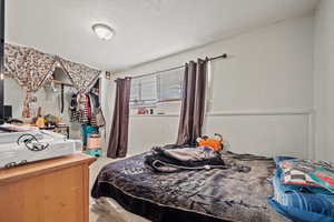 Bedroom featuring a textured ceiling