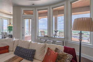 Living area featuring baseboards and wood finished floors