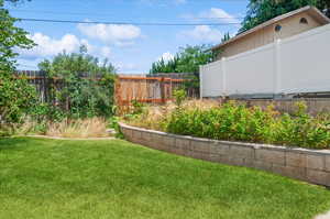 View of fenced backyard