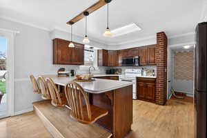 Open kitchen featuring a peninsula with bar seating