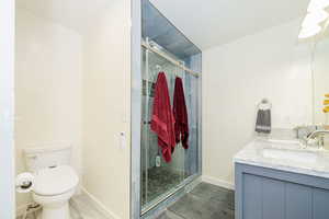 Primary Bathroom remodeled featuring vanity and an oversized shower with dual shower heads