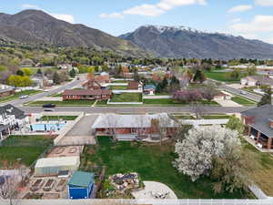 Aerial view of residential area with a panoramic mountain background