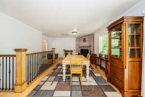 Dining room or 2nd family room on main level. Hardwood floors, crown molding, and fireplace