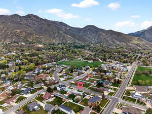 Aerial overview of property's location featuring panoramic mountain background
