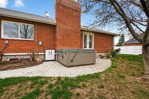 Detail shot of patio with included hotter and French door access to primary suite.